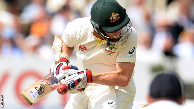 Chris Rogers is hit on the helmet