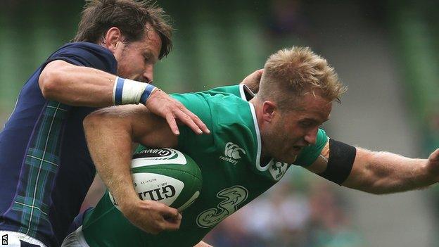 Scotland’s Peter Horne tackles Ireland winger Luke Fitzgerald