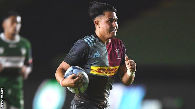 Marcus Smith runs in a try for Harlequins