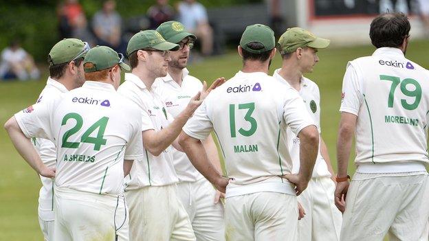 North Down celebrate taking a Derriaghy wicket