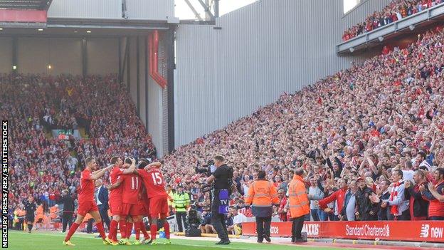 Roberto Firmino and his Liverpool team-mates celebrate the opening goal against Leicester