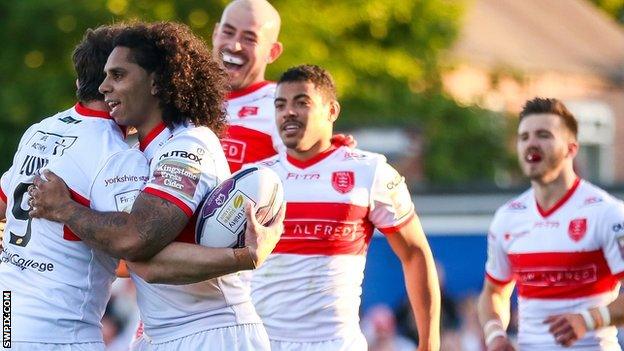 Shaun Lunt celebrates his try with the Rovers teammates.