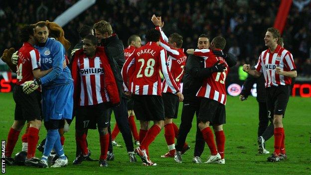 PSV players celebrate beating Spurs in 2008