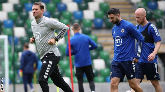 Ian Baraclough and his NI squad train