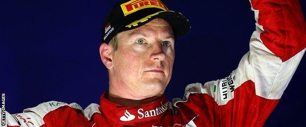 Kimi Raikkonen celebrates after finishing third at the Singapore grand prix