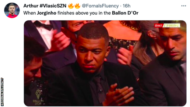 Picture of Kylian Mbappe looking unimpressed at the Ballon d'Or awards.