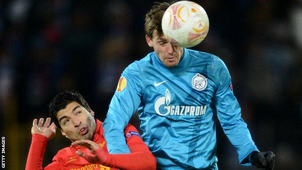 Liverpool's Luis Suarez and Zenit's Nicolas Lombaerts