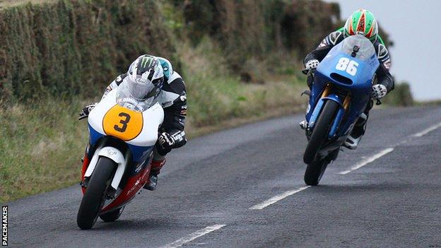 Michael Dunlop leads Derek McGee in the Lightweight Supersport race