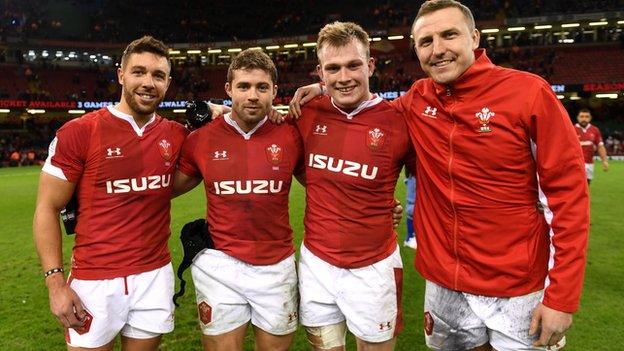 Wales quartet Rhys Webb, Leigh Halfpenny, Nick Tompkins and Hadleigh Parkes celebrate after defeating Italy