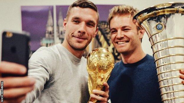 There were trophies aplenty on show when World Champion Nico Rosberg posed with his German compatriot and football World Cup winner Lukas Podolski.