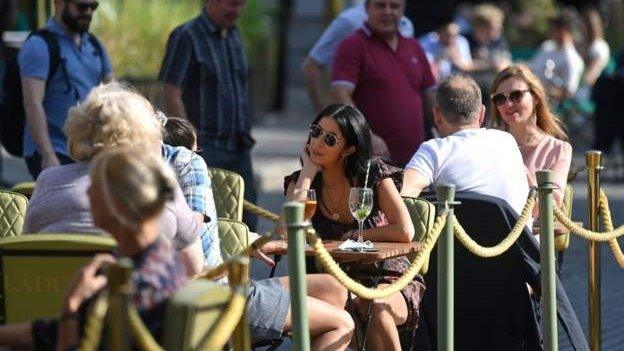 People sit outside at a restaurant