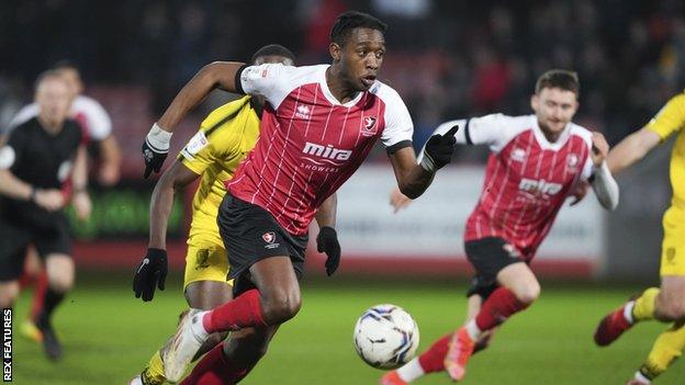 Dan Nlundulu playing for Cheltenham Town in League One