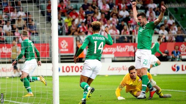 Kevin Long (left) and Callum Robinson (centre) celebrate Aiden O'Brien's goal in Wroclaw