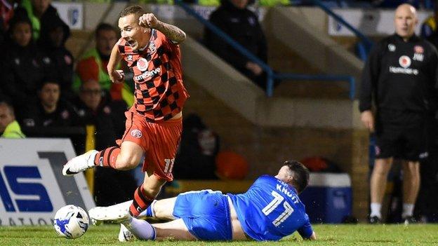 Walsall winger Kieron Morris is fouled by Gillingham midfielder Billy Knott in Tuesday's 1-1 draw at the Priestfield Stadium