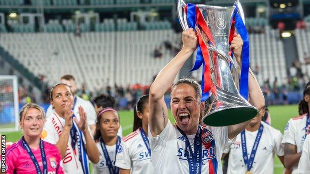 Sara Bjork Gunnarsdottir holds the Champions League trophy