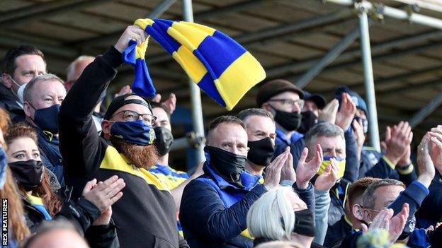 Only home fans were permitted inside the Halliwell Jones Stadium