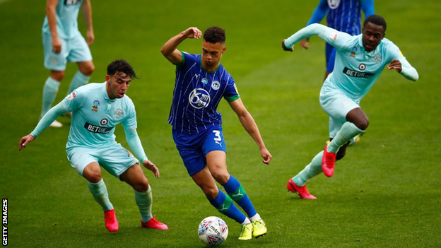 Antonee Robinson in action for Wigan against QPR