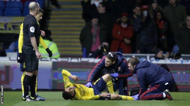 Lucas Torreira is treated by the Arsenal medical team after injuring his ankle against Portsmouth in the FA Cup