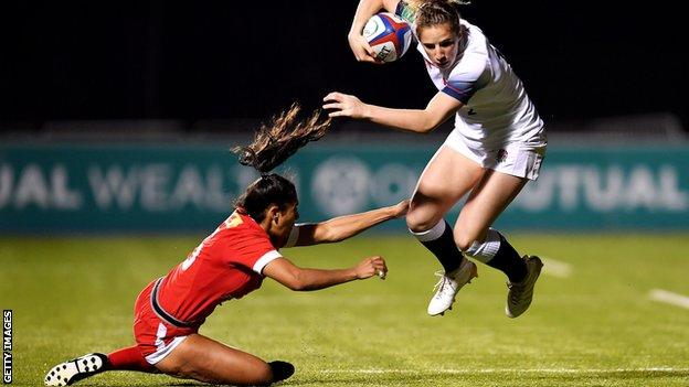 Abby Dow jumps out of a tackle