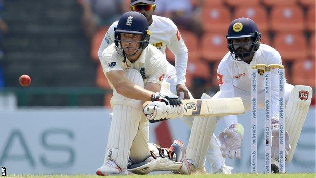 England batsman Jos Buttler plays a reverse sweep shot against Sri Lanka