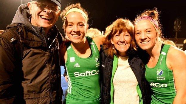 Bethany and Serena Barr pictured pitch-side with their mum and dad