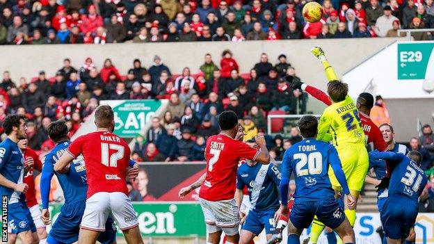 Birmingham keeper Tomasz Kuszczak clears as Bristol City put him under pressure