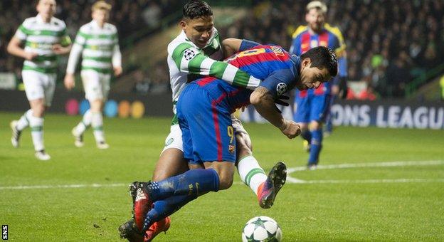 Celtic left-back Emilio Izaguirre brings down Luis Suarez to concede a penalty