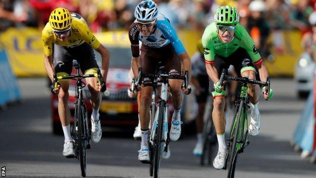 Chris Froome (left), Romain Bardet (centre) and Rigoberto Uran sprint for the line