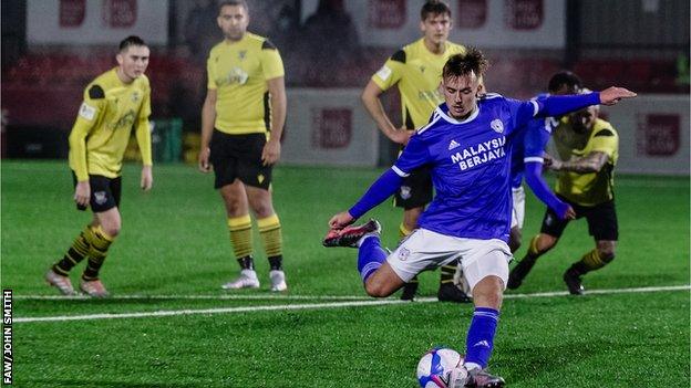 Isaak Davies scores from the penalty spot in Cardiff City's win over Cymru South side Taffs Well