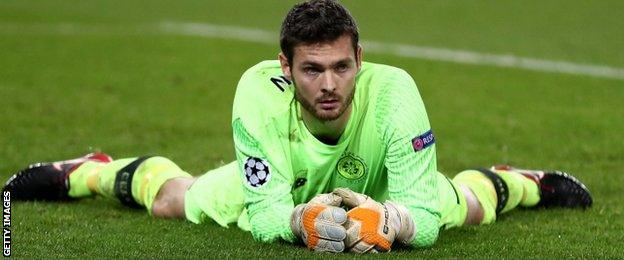 Craig Gordon lies on the ground after PSG score another goal