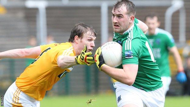 Antrim's Justin Crozier challenges Sean Quigley