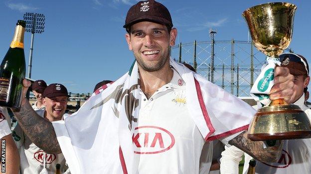 Jade Dernbach lifts the County Championship trophy with Surrey in 2018