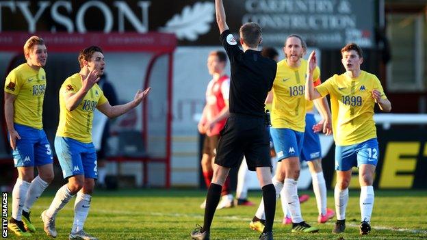 Torquay players appeal to the referee