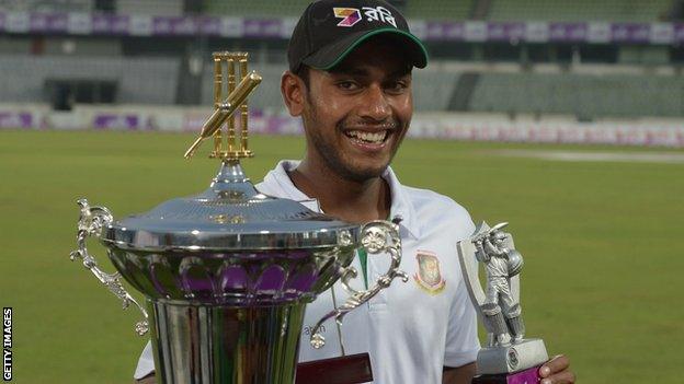 Mehedi Hasan shows off his man of the match and man of the series awards