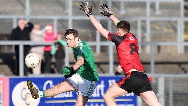 Fermanagh's Conal Jones attempts to get his shot beyond Down midfielder Cathal Doyle in the McKenna Cup clash