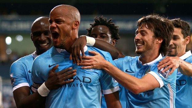 Manchester City captain Vincent Kompany celebrates with team-mates during the win at West Brom