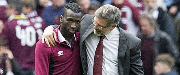 Esmael Goncalves is embraced by Craig Levein after the Murrayfield match