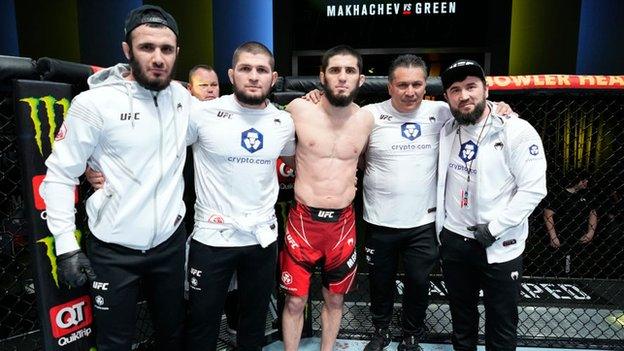 Khabib Nurmagomedov poses with Islam Makhachev for pictures