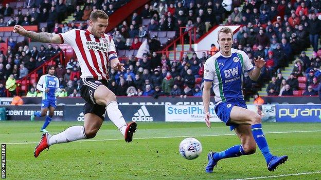 Sheffield United captain Billy Sharp scores his second goal for Sheffield United against Wigan Athletic