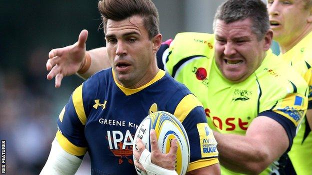 Wynand Olivier of Worcester Warriors runs past Sale Sharks player