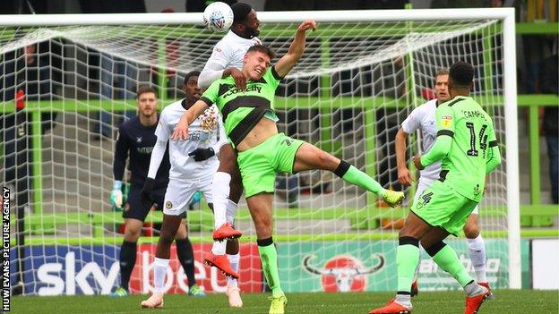 Tyreeq Bakinson of Newport County beats Paul Digby of Forest Green Rovers in a fiercely contested game