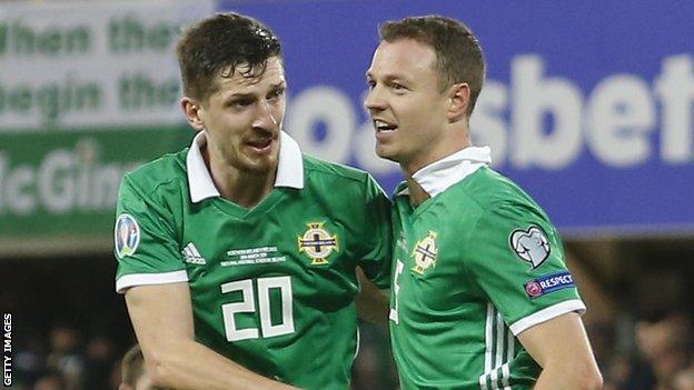 Craig Cathcart congratulates central defensive partner Jonny Evans after the Leicester player scored the opening goal