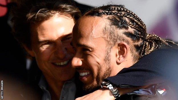 A photo of Tom Cruise and Lewis Hamilton