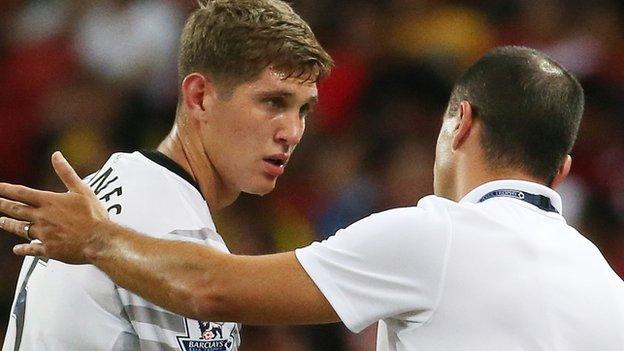 Roberto Martinez and John Stones