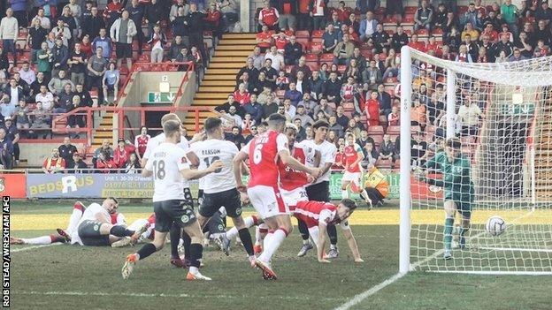 Jordan Davies scores Wrexham's dramatic stoppage time winner against Dover Athletic