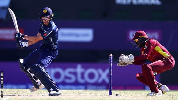 Olly Davidson (left) plays a shot for Scotland Under-19s