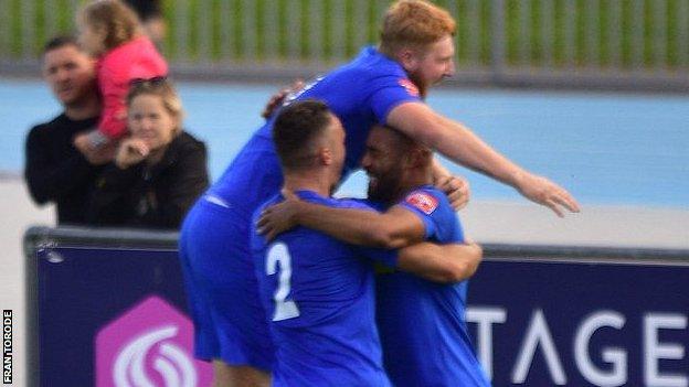 Ashford Town players celebrate