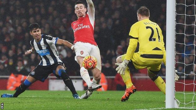 Laurent Koscielny (centre) scores for Arsenal