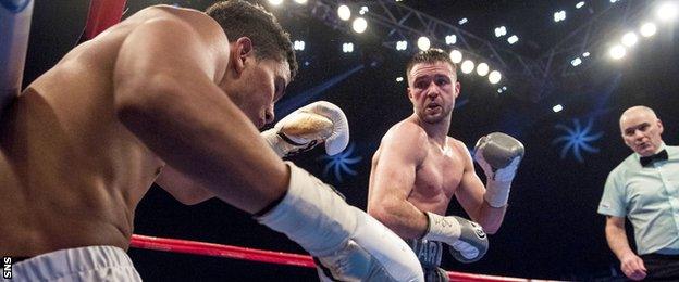 Winston Campos is floored by Josh Taylor at Glasgow Hydro