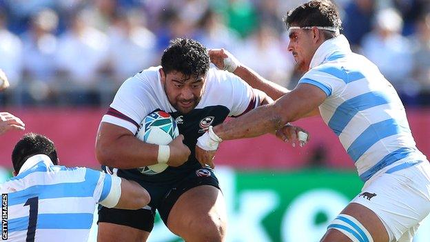 Titi Lamositele is tackled by Argentina players